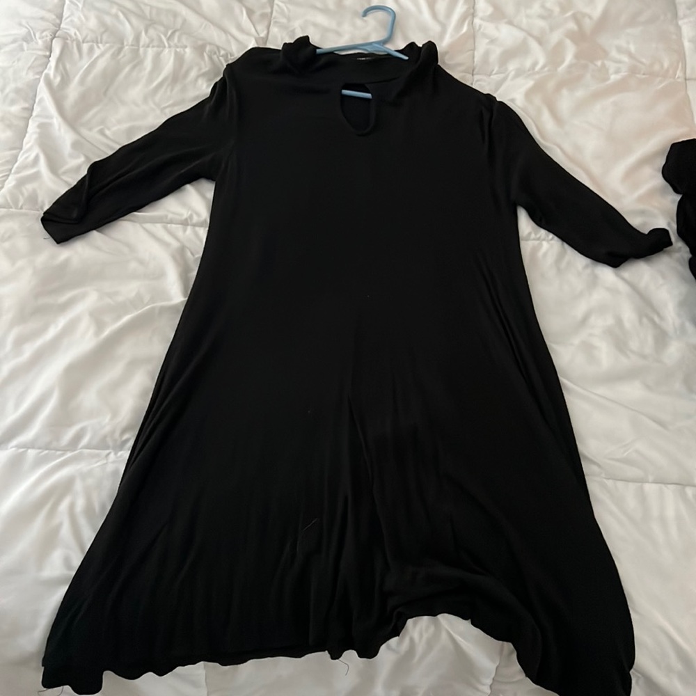Mid length, lightweight, large rue 21 dress with high neck and cutout.